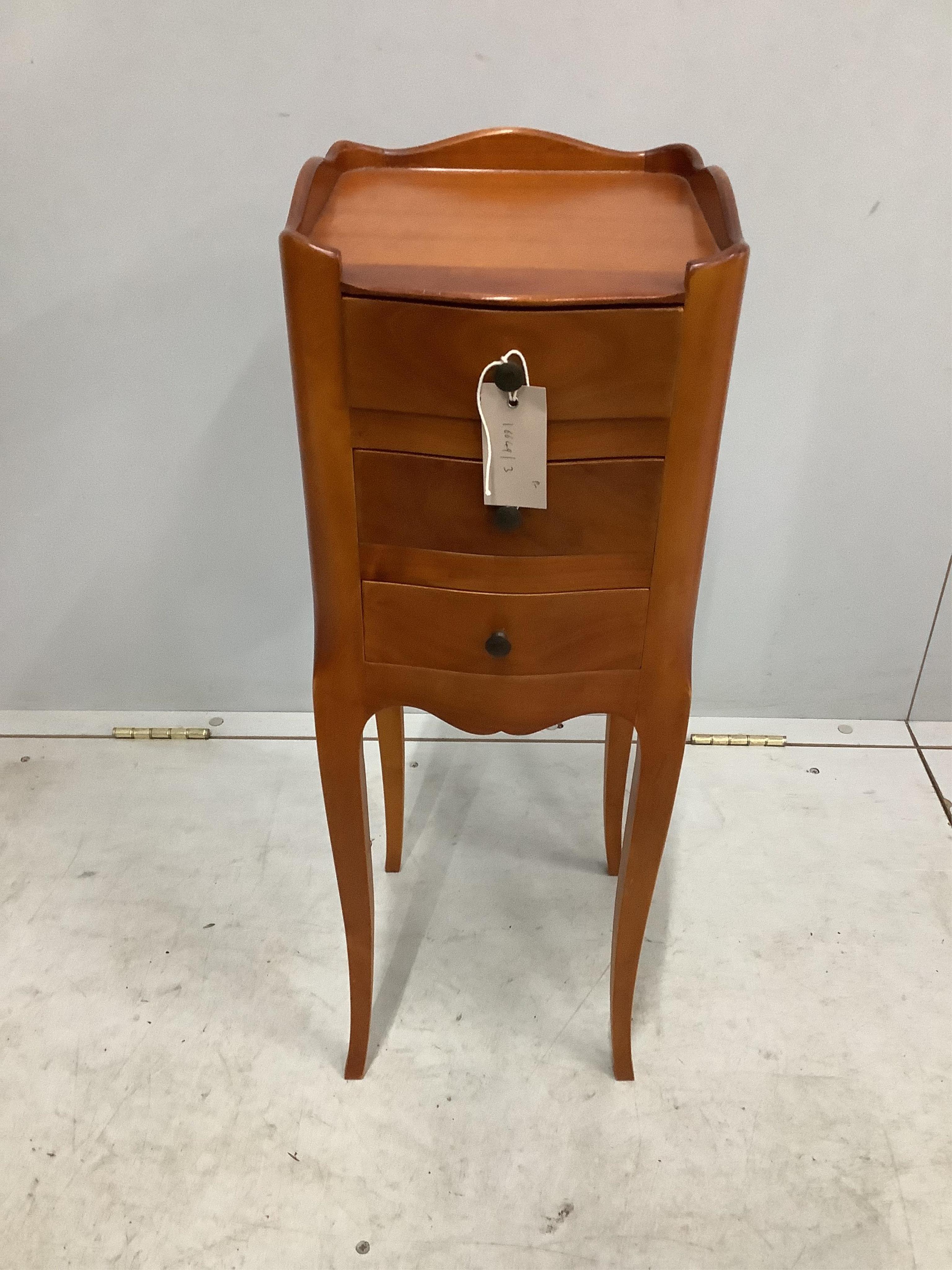 A pair of French cherry three drawer bedside chests, width 24cm, depth 26cm, height 70cm. Condition - fair to good